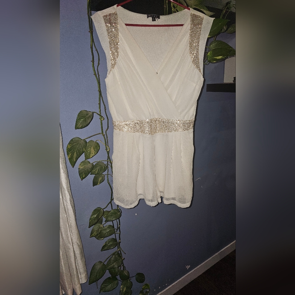 3/20.00. Classy white romper with sequins.